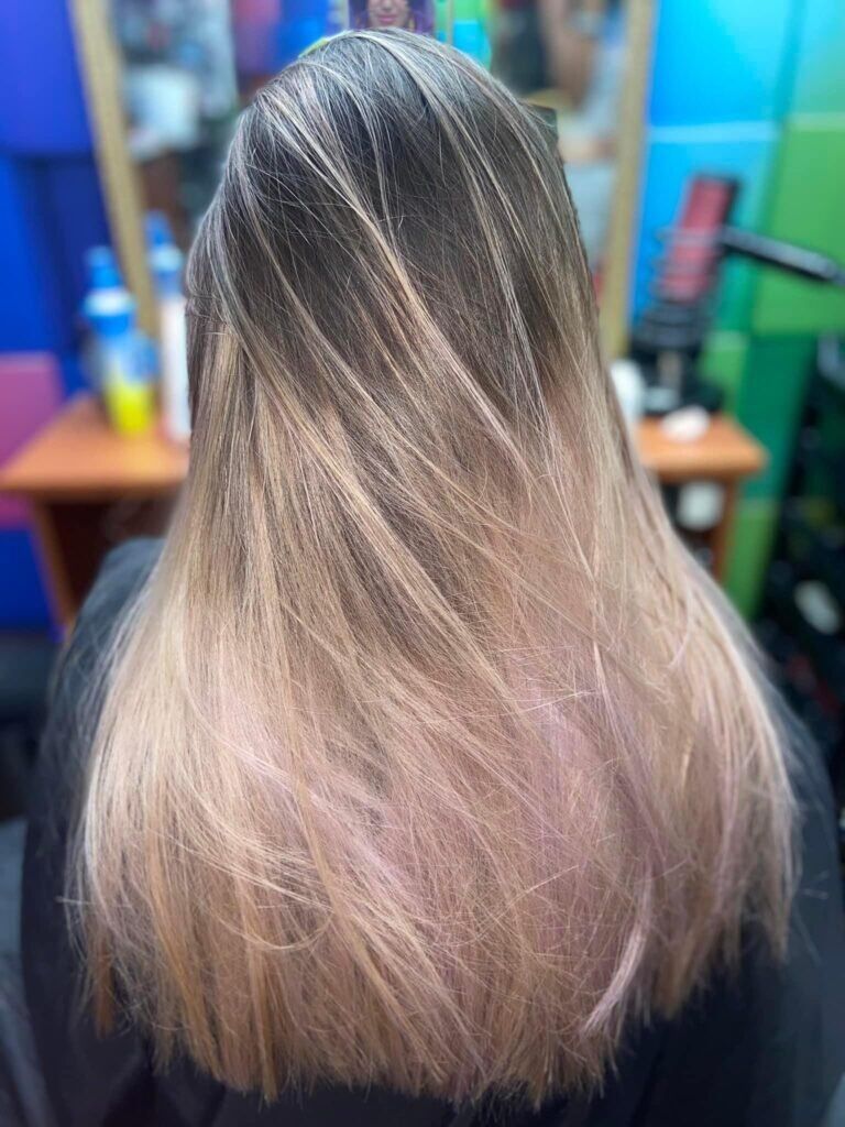 Image featuring long hair adorned with expertly blended highlights,